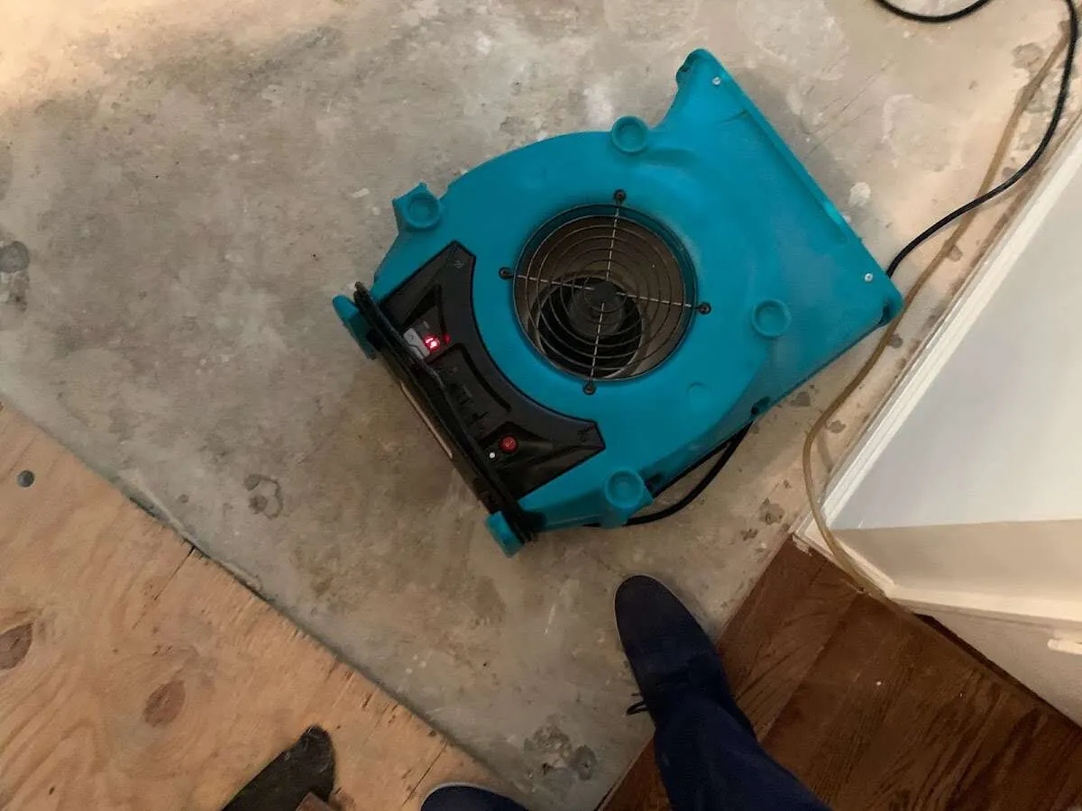 Air mover drying subfloor during Commercial Water Damage Restoration in South Lake Tahoe